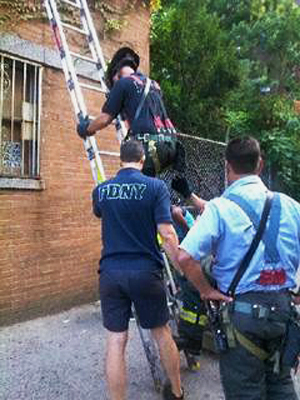 FDNY climbing up ladder