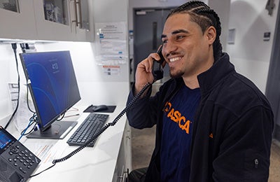 An ASPCA Poison Control staff member answering a phone call