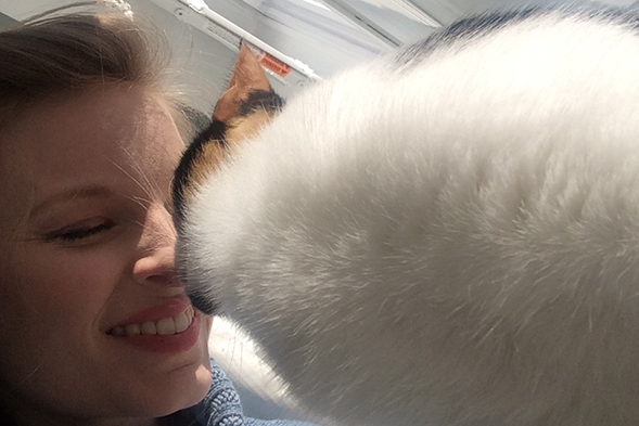 Cat kissing woman's nose