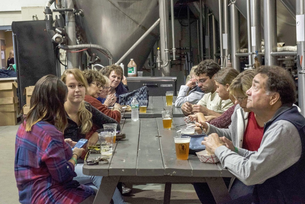 People at a table drinking beer