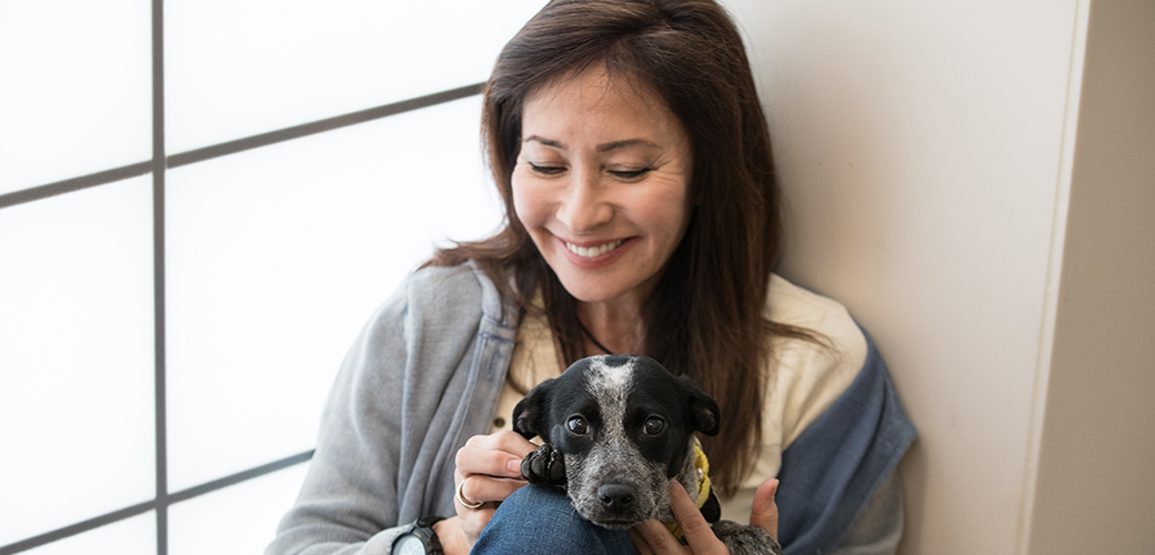 a woman with a puppy