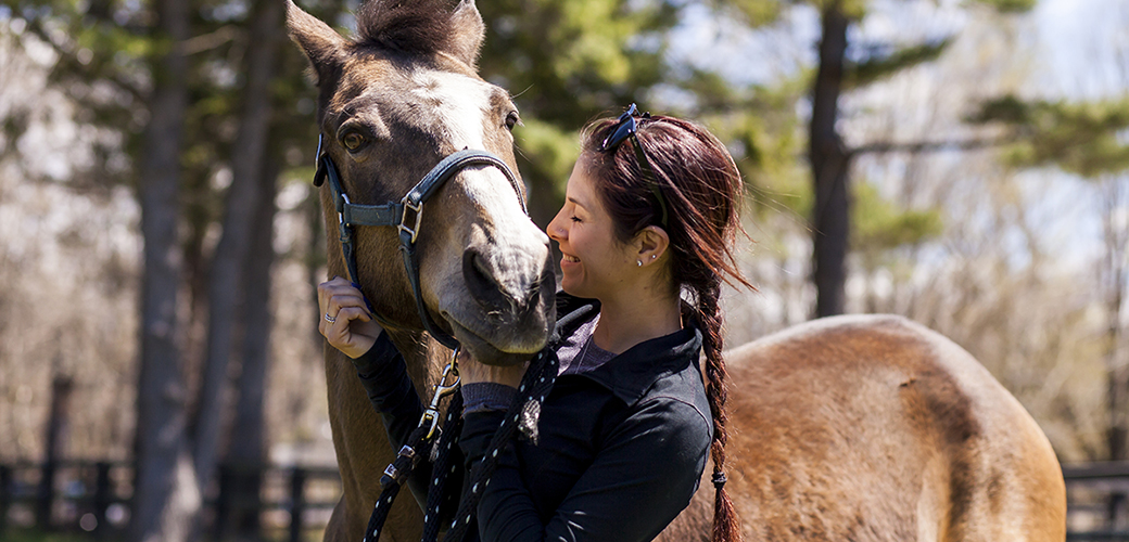 a woman with a horse