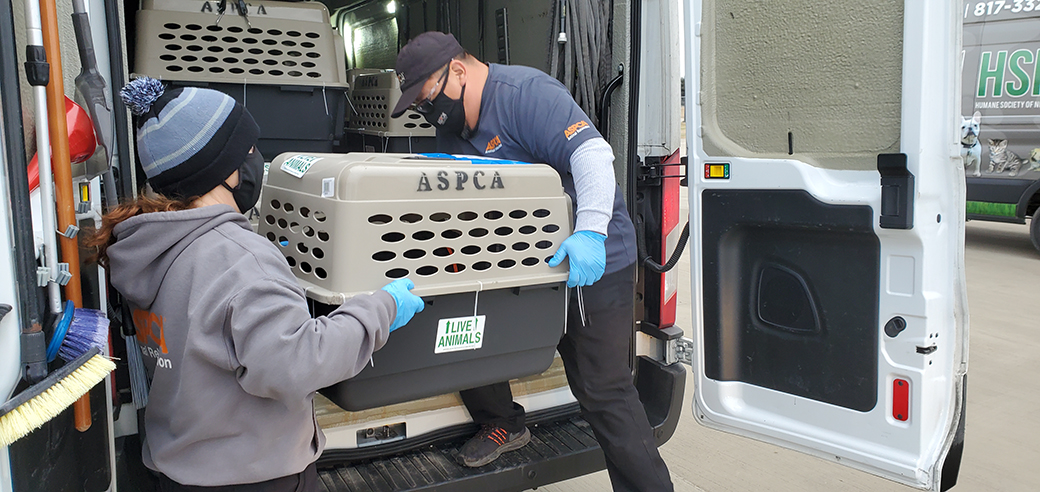 ASPCA responders unloading rescued animals from a transport truck