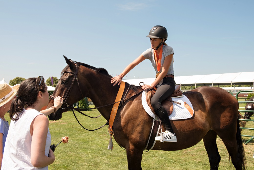 Jessica Springsteen shows off an adoptable horse.