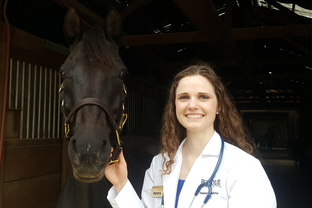 Danielle, an equine veterinarian, and a horse