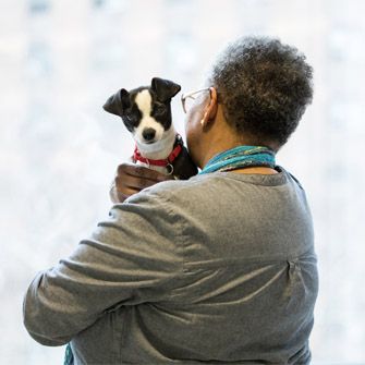 Woman holding dog